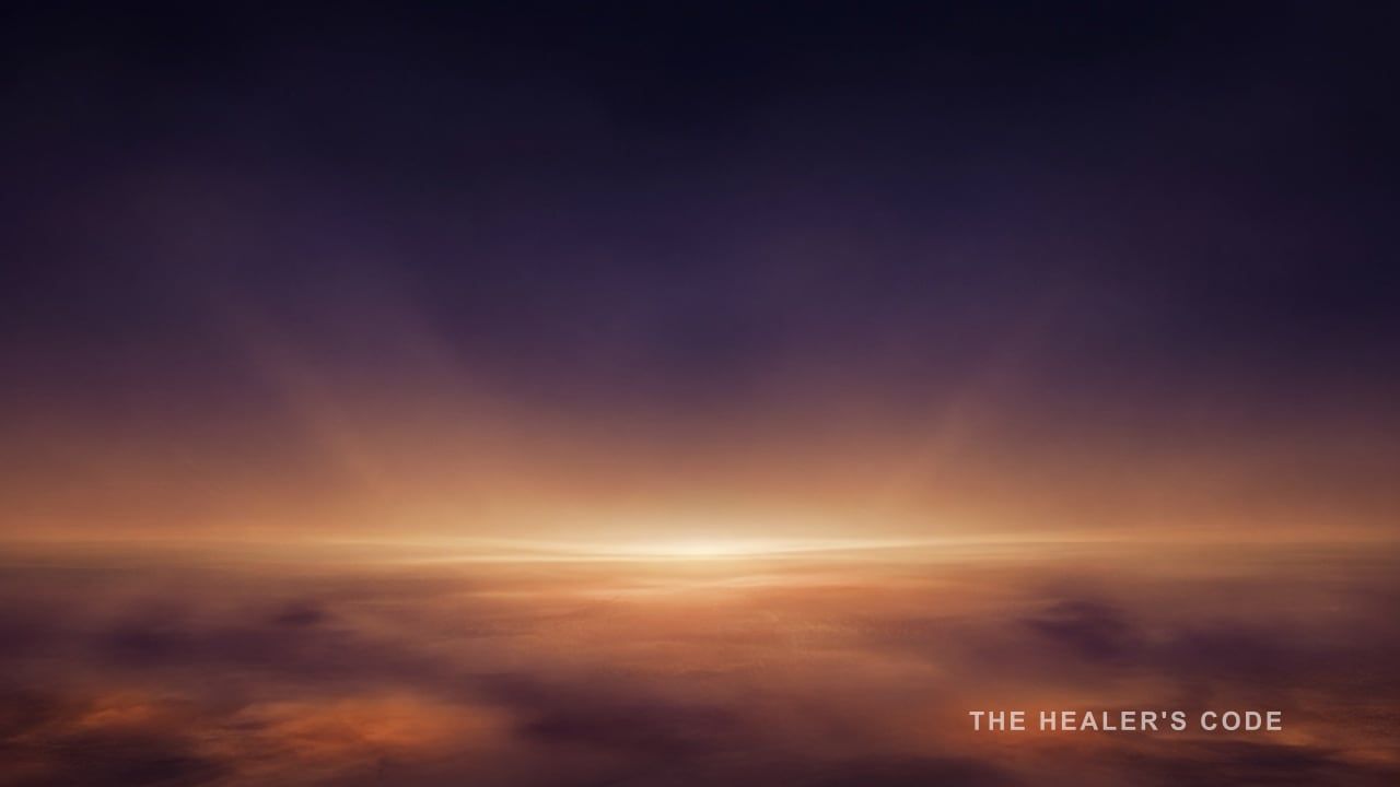 Gold light unfolds along a distant horizon in a deep indigo twilight sky