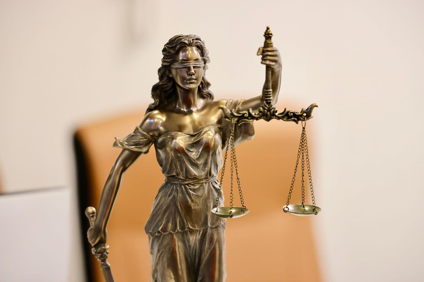 A Lady Justice statue holding the scales