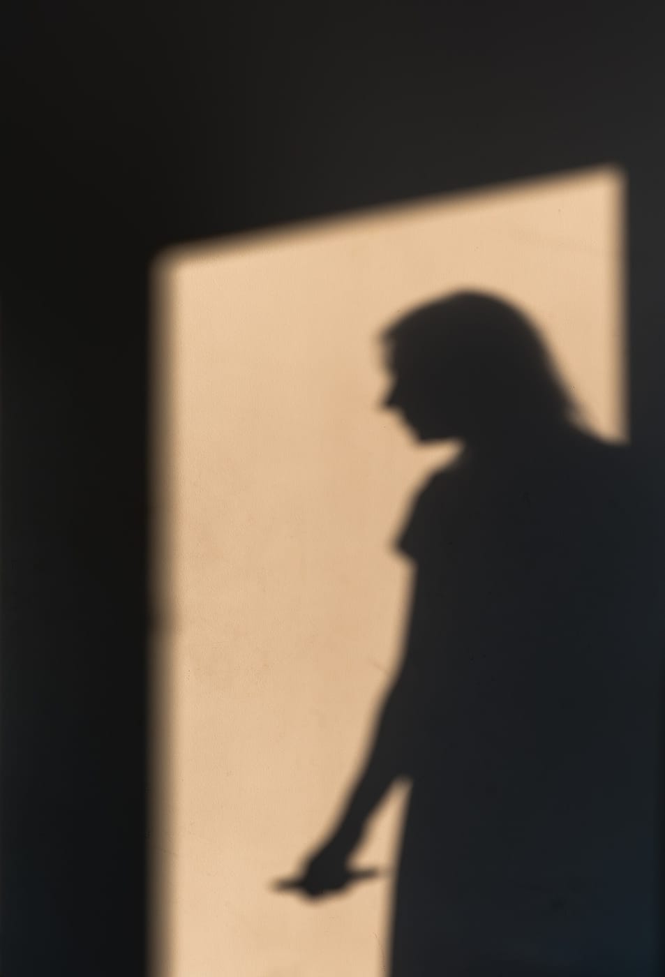 A woman's shadow on a white wall, Lisbon