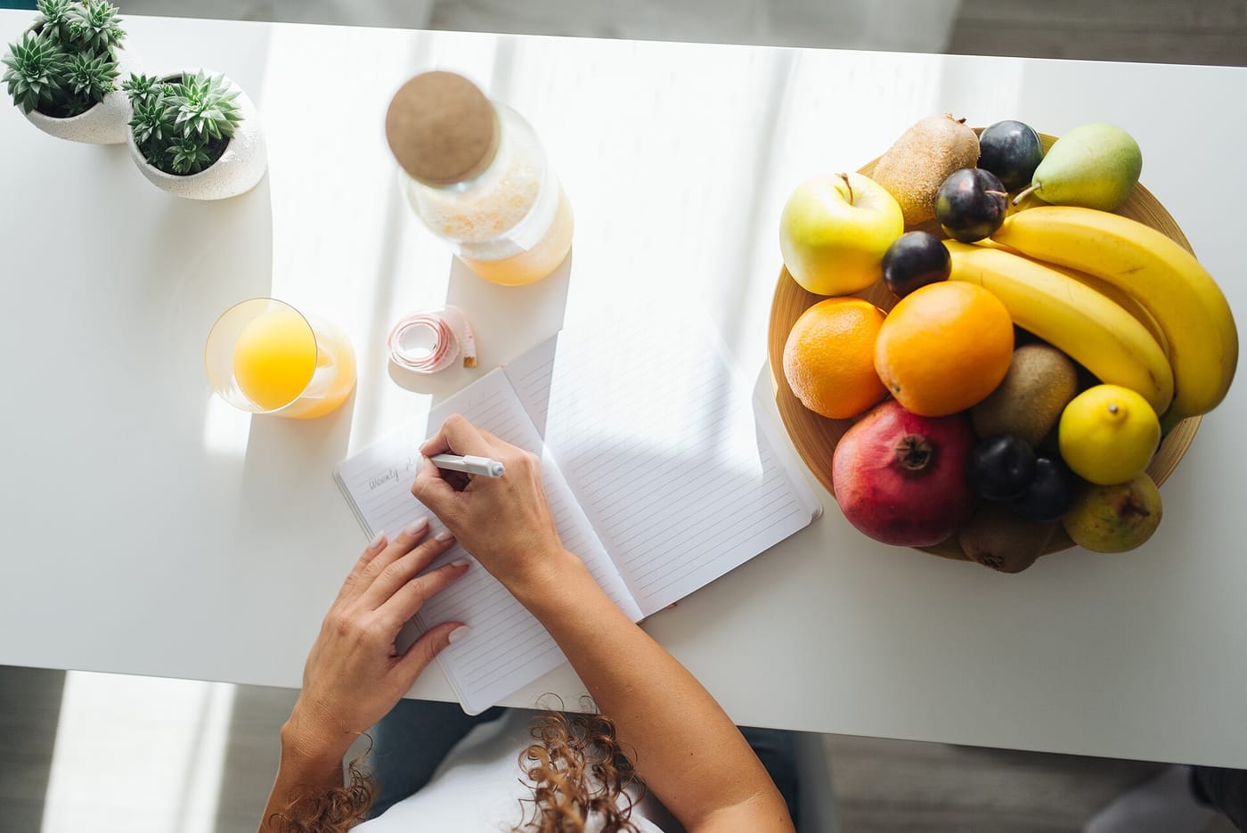 Writing notes at a kitchen table